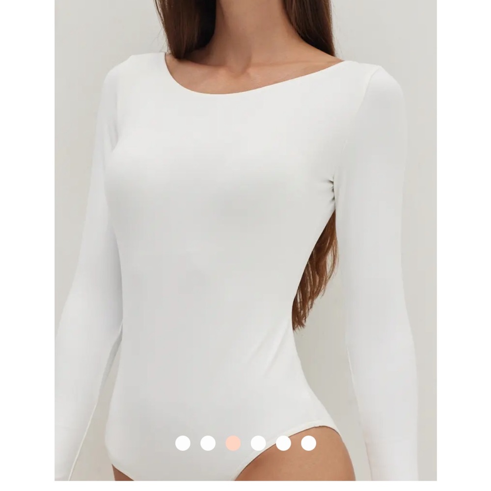Beautiful bodysuit brand new with tags.
